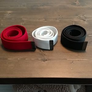 Red, white, and black Nike golf belts